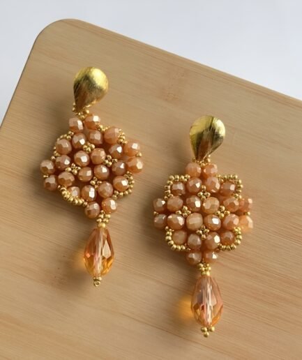 Aretes largos rombo en cristal rosa con gota ámbar
